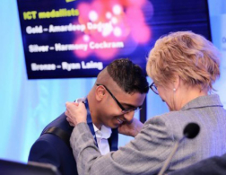 young person receiving medal