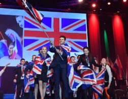 Photo of competitors carrying UK flags on stage at WorldSkills Gothenburg 2016