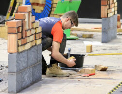 Young person competing in Bricklaying competition