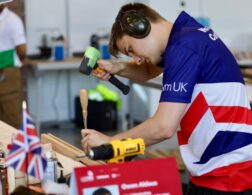 Photo of Owen competing internationally in the cabinet making competition