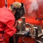 Young person competing in Welding competition